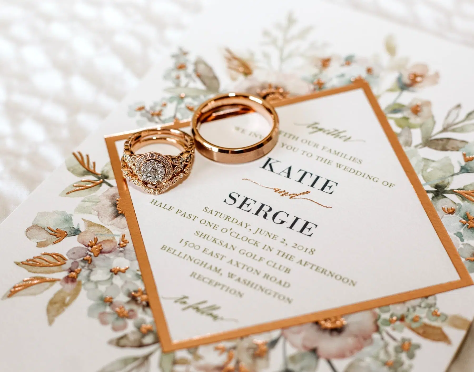 rose gold bellingham wedding invitation and rings