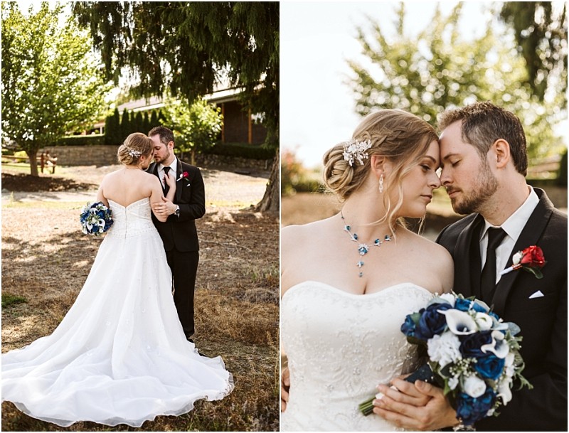 Premier Snohomish & Seattle Wedding Photographer | GSquared Weddings Photography A bride in a white gown and a groom in a black suit share an intimate moment outdoors during their Snohomish Seattle wedding, holding a bouquet of blue and white flowers as they stand close under sunlit trees. 47.9129° N, 122.0982° W | Serving Snohomish, Seattle , Orlando & Beyond