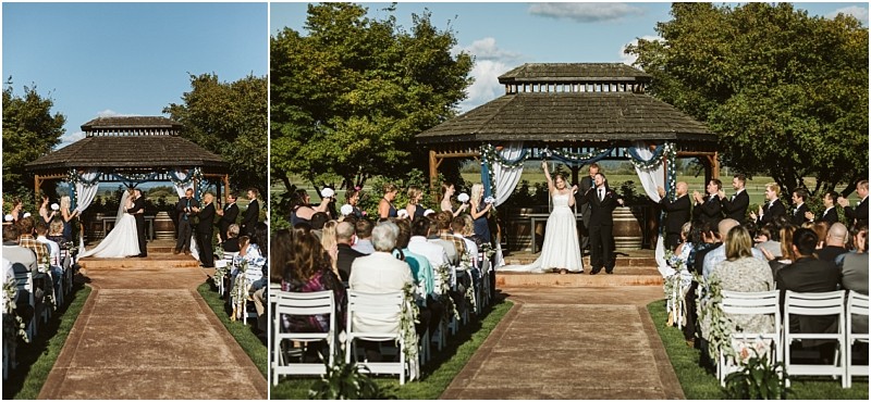 Premier Snohomish & Seattle Wedding Photographer | GSquared Weddings Photography A beautiful Snohomish wedding ceremony outdoors, with a bride and groom standing under a wooden gazebo, surrounded by their wedding party and guests seated on white chairs along an aisle lined with lush greenery. 47.9129° N, 122.0982° W | Serving Snohomish, Seattle , Orlando & Beyond
