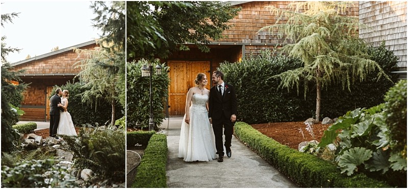 Premier Snohomish & Seattle Wedding Photographer | GSquared Weddings Photography A bride and groom walk together and embrace in a lush garden courtyard outside a wooden building, surrounded by greenery and hedges—a romantic Snohomish Seattle wedding moment. 47.9129° N, 122.0982° W | Serving Snohomish, Seattle , Orlando & Beyond