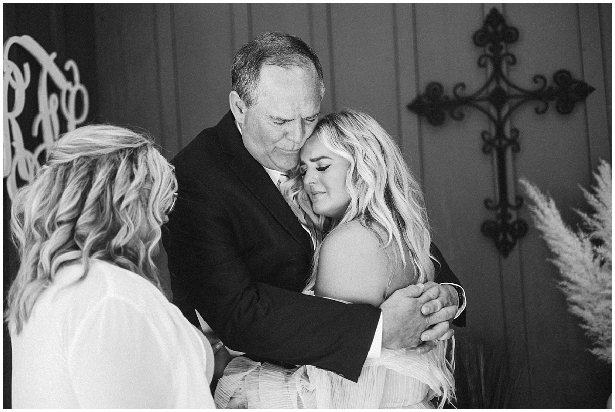 wedding moments best of 2021 mom and dad praying with bride