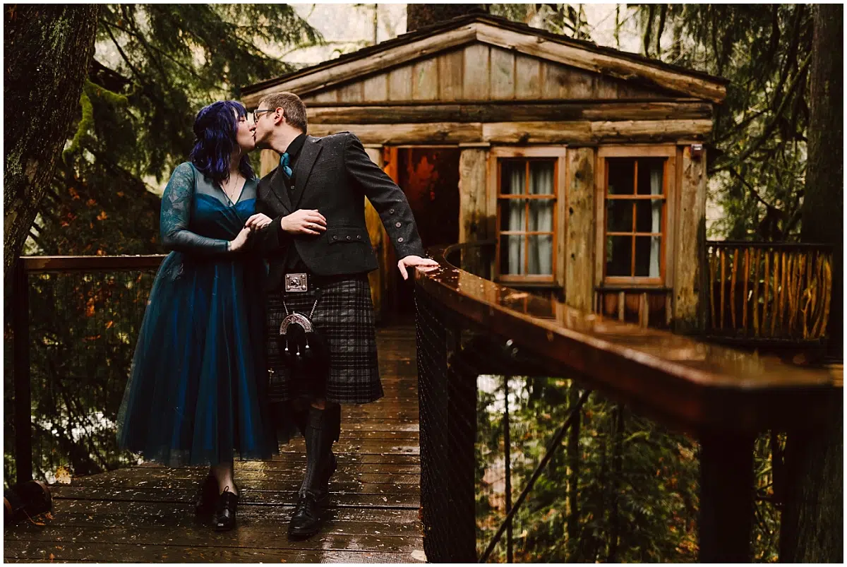 treehouse wedding at treehouse point with bride in a teal blue dress by french knot couture and groom in a scottish kilt by the blue moon treehouse in fall city wa