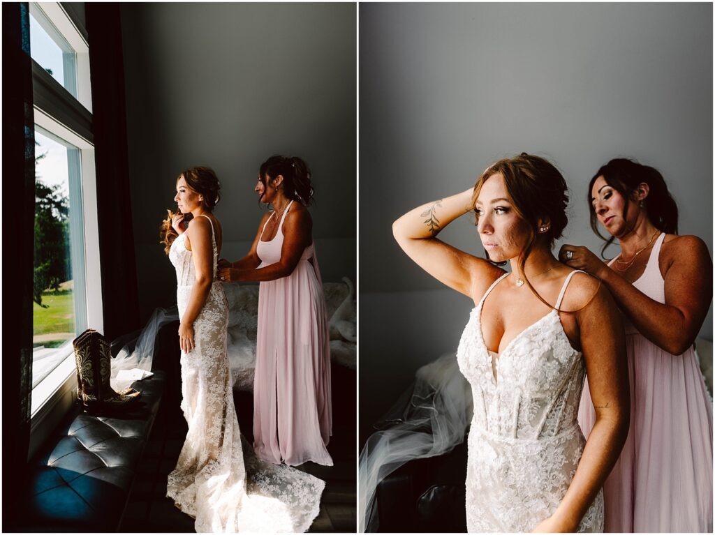 Snohomish Wedding Photographer GSquared Weddings Two women in a softly lit room prepare for a wedding. The bride, in a detailed lace gown, stands by a window as the other woman adjusts her dress. The setting is intimate and serene, with natural light highlighting the moment. Serving Seattle, Snohomish and Orlando