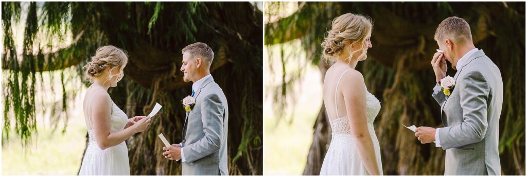 Snohomish Wedding Photographer GSquared Weddings A bride and groom stand outdoors under a tree. The bride, in a white lace dress, reads vows while the groom, in a light gray suit, listens and wipes his eye. Theyre exchanging heartfelt moments in a serene natural setting. Serving Seattle, Snohomish and Orlando