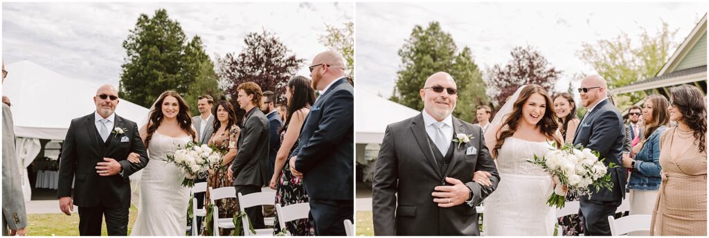 Snohomish Wedding Photographer GSquared Weddings A bride walks down the aisle outdoors, accompanied by a man in a suit. She carries a bouquet of white flowers, smiling. Guests in formal attire watch and smile. Trees and a large white tent are in the background. Serving Seattle, Snohomish and Orlando