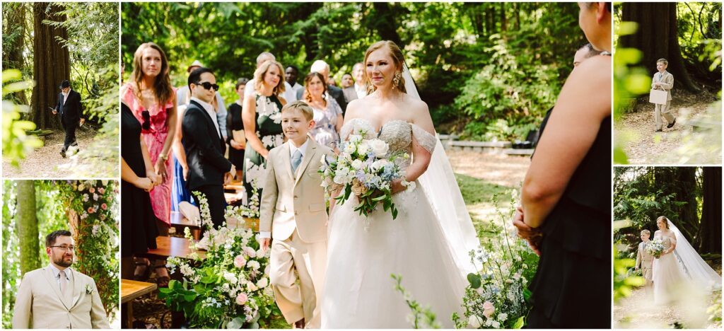 Snohomish Wedding Photographer GSquared Weddings A bride in a white gown walks down an outdoor aisle adorned with flowers, accompanied by a young boy in a suit. Guests stand on either side, surrounded by lush greenery in a forest setting. Serving Seattle, Snohomish and Orlando