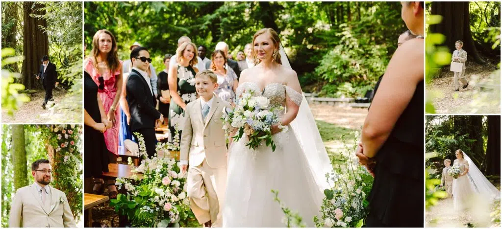 Snohomish Wedding Photographer GSquared Weddings A bride in a white gown walks down an outdoor aisle adorned with flowers, accompanied by a young boy in a suit. Guests stand on either side, surrounded by lush greenery in a forest setting. Serving Seattle, Snohomish and Orlando