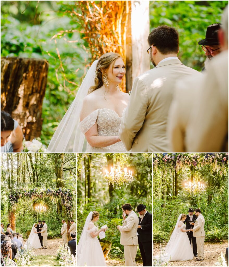 Snohomish Wedding Photographer GSquared Weddings A bride and groom stand together in an outdoor forest wedding ceremony. The bride is in a white gown with a veil, and the groom wears a light suit. They exchange vows under a floral arch with a chandelier. Lush greenery surrounds them. Serving Seattle, Snohomish and Orlando