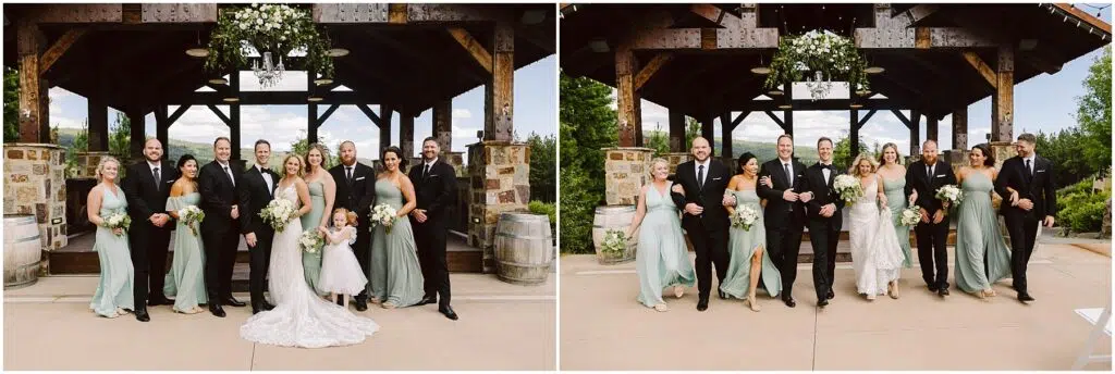 Snohomish Wedding Photographer GSquared Weddings Wedding party in formal attire poses and walks outside a rustic venue. The bridesmaids wear sage green dresses, and the groomsmen are in black suits. The bride is in a white gown. They are all smiling with greenery and wooden beams in the background. Serving Seattle, Snohomish and Orlando