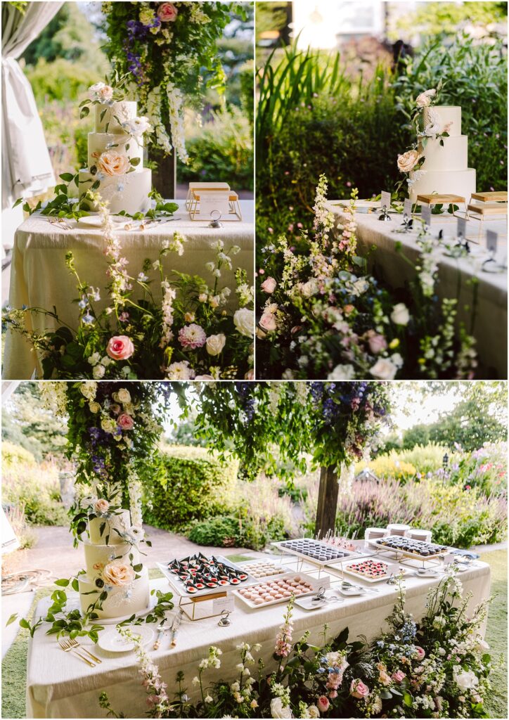 Snohomish Wedding Photographer GSquared Weddings A tiered wedding cake adorned with flowers sits on a table set outside in a garden. The table is decorated with floral arrangements and various desserts, including pastries and fruit tarts, surrounded by lush greenery. Serving Seattle, Snohomish and Orlando