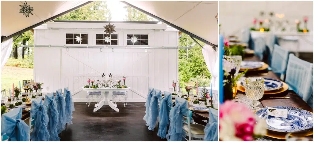 Snohomish Wedding Photographer GSquared Weddings A wedding reception area with a long table set for dining. Chairs are adorned with blue fabric, and tables feature elegant blue and white plates, crystal glasses, and flower centerpieces. White curtains and hanging star decorations add a festive touch. Serving Seattle, Snohomish and Orlando