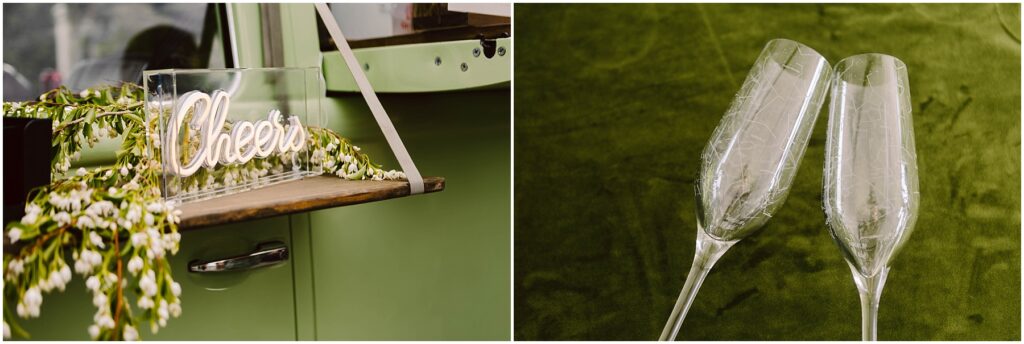 Snohomish Wedding Photographer GSquared Weddings A neon sign reading Cheers is displayed on a ledge with greenery draped around it. Next to it, two empty champagne glasses are set on a green surface. The background includes part of a mint green vehicle. Serving Seattle, Snohomish and Orlando