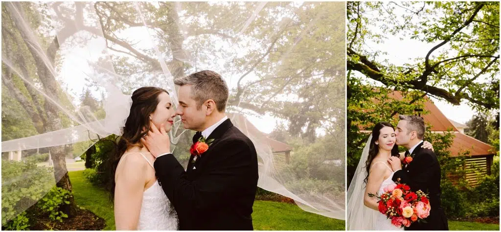 Snohomish Wedding Photographer GSquared Weddings A couple stands outdoors under trees, embracing on their wedding day. The brides veil billows in the breeze as they share a tender moment. She holds a vibrant bouquet of red and orange flowers. Both are dressed in formal attire, exuding joy and love. Serving Seattle, Snohomish and Orlando