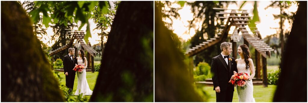 Snohomish Wedding Photographer GSquared Weddings Bride and groom in formal attire stand in a lush outdoor setting, under a wooden archway. The bride holds a vibrant bouquet of red and orange flowers. Trees and greenery surround them, creating a romantic atmosphere. Serving Seattle, Snohomish and Orlando