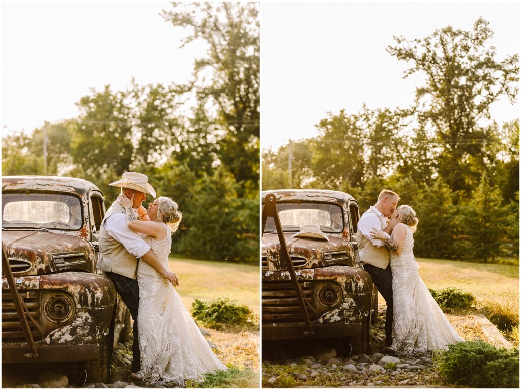 Snohomish Wedding Photographer GSquared Weddings A couple embraces by an old, rustic truck in a sunny field. The man wears a straw hat, white shirt, and vest, while the woman wears a white lace dress. Trees and grass are in the background, creating a warm, romantic setting. Serving Seattle, Snohomish and Orlando