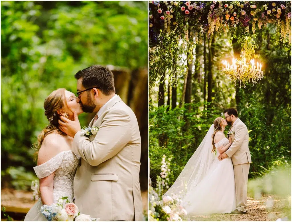 Snohomish Wedding Photographer GSquared Weddings A couple shares a kiss in a lush forest setting. The bride wears an off-shoulder dress with a long veil, holding a bouquet. The groom is in a beige suit. They stand beneath a floral arch with a chandelier. Serving Seattle, Snohomish and Orlando