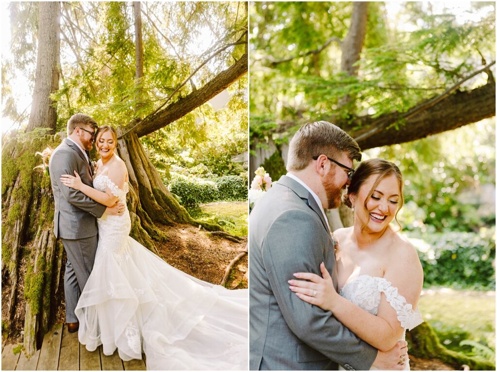 Snohomish Wedding Photographer GSquared Weddings A bride and groom embrace under a large tree. The bride wears an off-shoulder white wedding dress, and the groom is in a gray suit. They are smiling, surrounded by lush greenery and dappled sunlight. Serving Seattle, Snohomish and Orlando