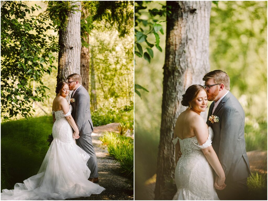 Snohomish Wedding Photographer GSquared Weddings A couple in wedding attire stands affectionately in a lush, green forest setting. The bride, in a white gown, and the groom, in a gray suit, share a tender moment next to a tree. The scene is bright and serene. Serving Seattle, Snohomish and Orlando