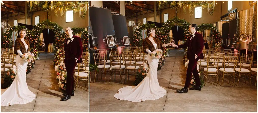 Snohomish Wedding Photographer GSquared Weddings A couple in formal attire stands in an elegant venue decorated with flowers and golden chairs. The bride wears a white gown and fur shrug, holding a bouquet. The groom in a burgundy suit offers his hand to her. Soft lighting enhances the ambiance. Serving Seattle, Snohomish and Orlando