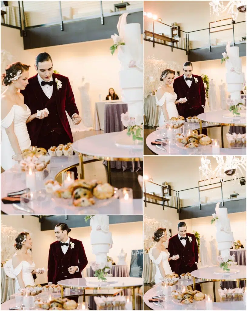 Snohomish Wedding Photographer GSquared Weddings A couple, dressed in formal attire with the man in a burgundy suit, are engaged in a wedding cake-cutting ceremony. The setting is elegantly decorated with flowers, candles, and a large tiered cake on a table. Serving Seattle, Snohomish and Orlando