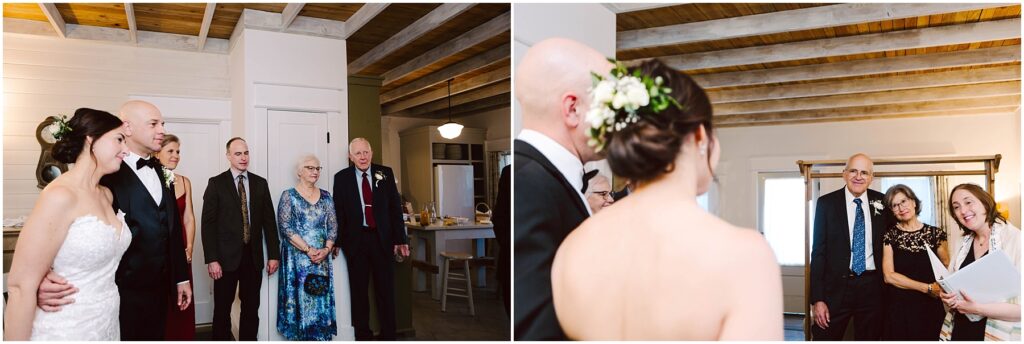 Snohomish Wedding Photographer GSquared Weddings Wedding ceremony with a couple and guests in a cozy room. The bride wears a white dress and flower crown, while the groom is in a suit. Other guests, wearing formal attire, stand nearby. The room has wooden ceilings and bright natural light. Serving Seattle, Snohomish and Orlando