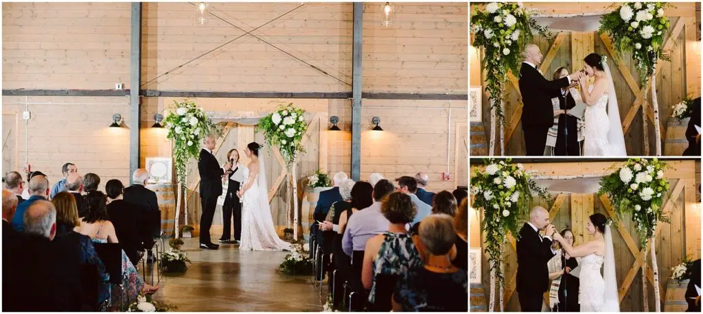Snohomish Wedding Photographer GSquared Weddings A couple is getting married in a rustic venue with wooden walls and floral decorations. The bride and groom are under a floral arch. Guests are seated, watching the ceremony. The couple exchanges vows and perform a sand pouring ritual. Serving Seattle, Snohomish and Orlando