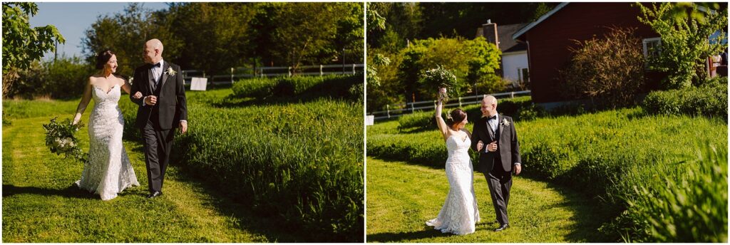 Snohomish Wedding Photographer GSquared Weddings A bride and groom walk joyfully through a grassy path on their wedding day. The bride holds a bouquet and wears a lace gown, while the groom is in a black suit. A rustic house and trees are visible in the background under a clear blue sky. Serving Seattle, Snohomish and Orlando