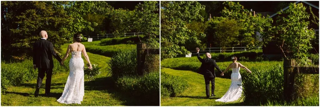 Snohomish Wedding Photographer GSquared Weddings A couple walks hand in hand on a sunlit grassy path, surrounded by lush greenery. The bride wears a strapless white gown, while the groom wears a black suit. They raise their joined hands in celebration, moving toward a scenic, tree-lined backdrop. Serving Seattle, Snohomish and Orlando