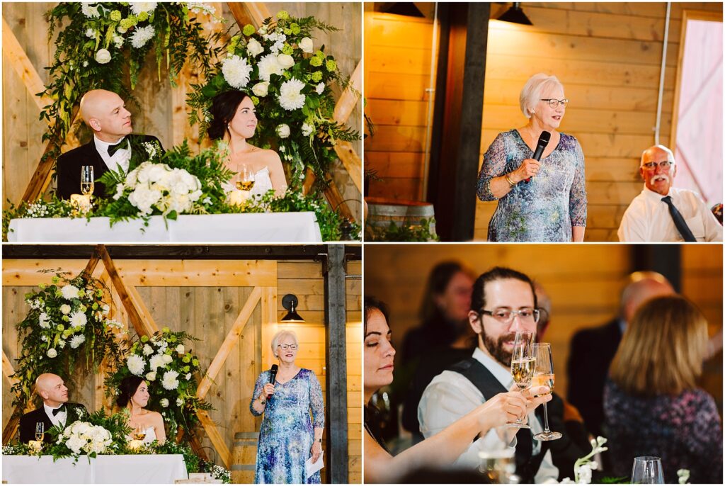 Snohomish Wedding Photographer GSquared Weddings A wedding scene with a couple at a beautifully decorated table. A woman in a blue dress gives a speech. Guests raise glasses in a toast. Wooden walls and floral arrangements create a rustic atmosphere. Serving Seattle, Snohomish and Orlando