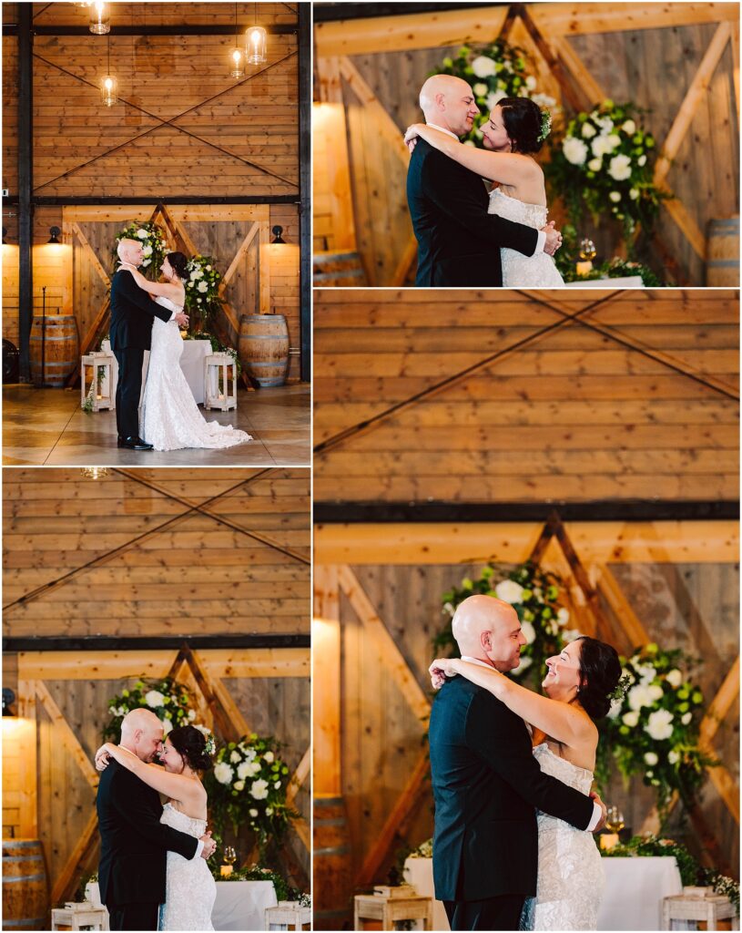 Snohomish Wedding Photographer GSquared Weddings A couple is having their first dance at a wedding. They are embracing in front of a rustic wooden backdrop with floral arrangements. The bride is wearing a white gown, and the groom is in a black suit. Warm lighting creates a romantic atmosphere. Serving Seattle, Snohomish and Orlando