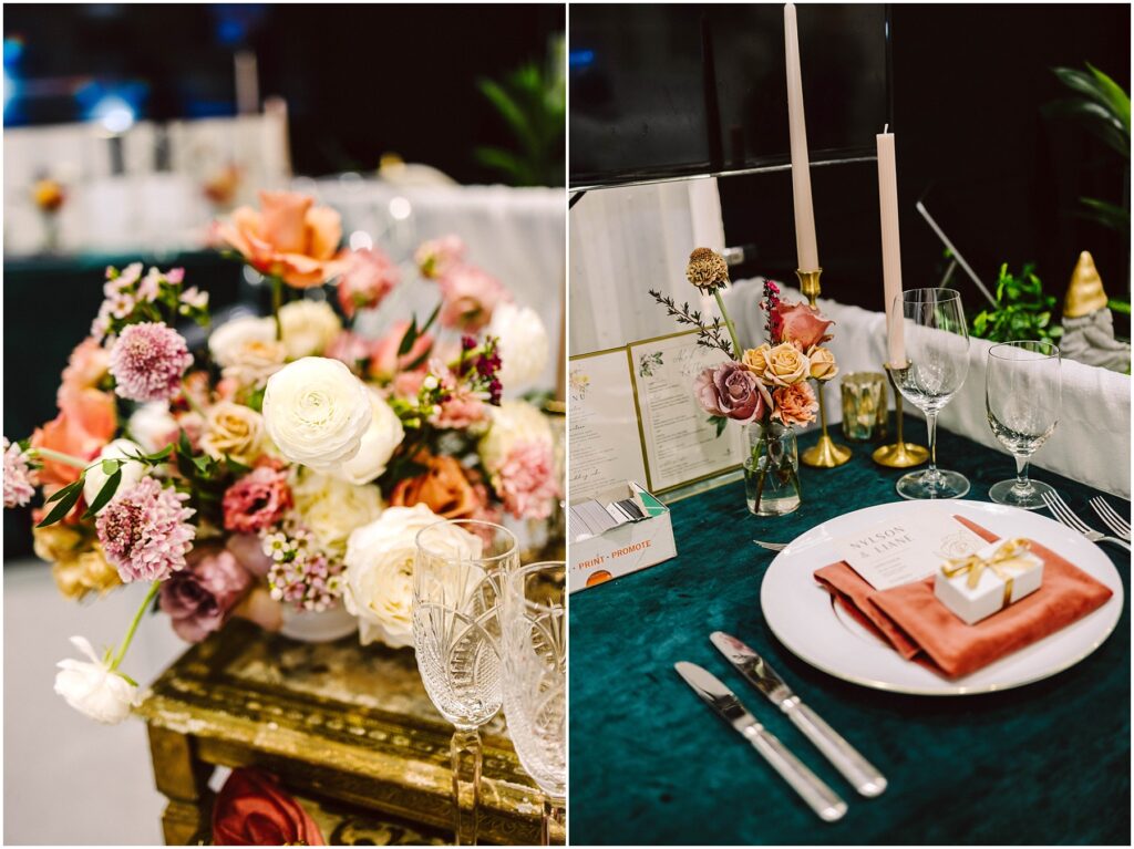 Snohomish Wedding Photographer GSquared Weddings A table setting with elegant flower arrangements featuring roses and greenery. A plate with a pink napkin, cutlery, a menu, and a gift box is placed beside wine glasses and tall candles on a green tablecloth. Serving Seattle, Snohomish and Orlando