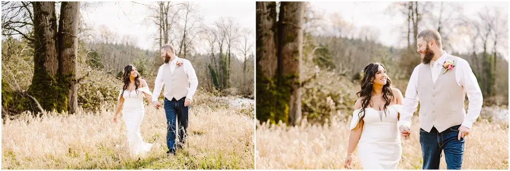 Snohomish Wedding Photographer GSquared Weddings A bride in a white dress and a groom in a light vest stroll hand in hand through a grassy field near Machias. With trees and a river as their backdrop, they smile at each other under the bright skies. Serving Seattle, Snohomish and Orlando