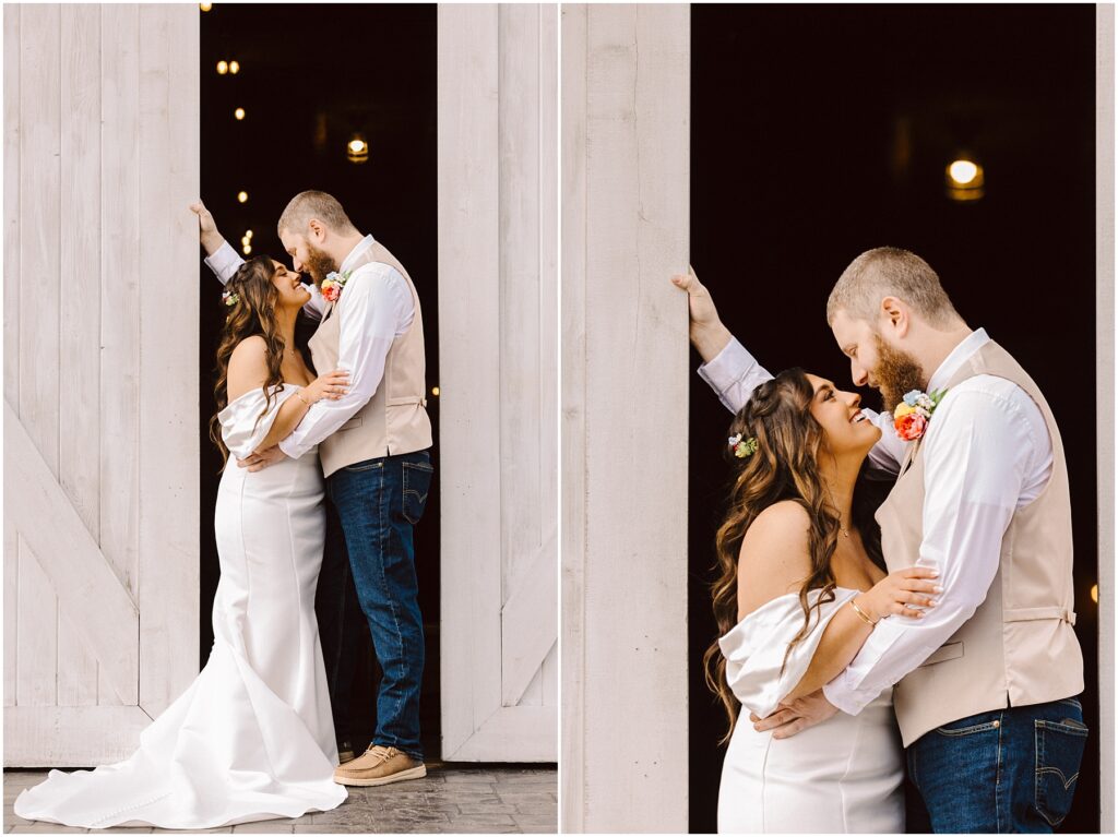 Snohomish Wedding Photographer GSquared Weddings A couple stands affectionately in front of rustic white barn doors in Machias. The woman, in a white dress, gazes up smiling at the man, who wears a vest and jeans. They share a loving moment, highlighted by soft, ambient lighting. Serving Seattle, Snohomish and Orlando