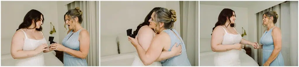 Snohomish Wedding Photographer GSquared Weddings Three images capture a heartfelt moment at a summer wedding in Port Gamble. Two women, one in a white dress and the other in blue, exchange a box, hug, and hold hands in a brightly lit room adorned with beige curtains and a cozy bed. Serving Seattle, Snohomish and Orlando