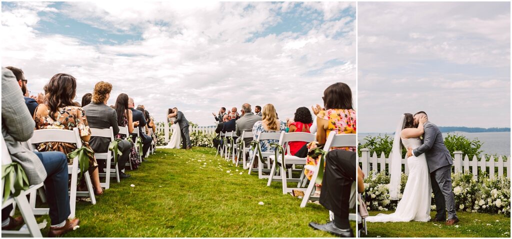 Snohomish Wedding Photographer GSquared Weddings At a summer wedding by the sea in Port Gamble, a couple shares a kiss under partly cloudy skies. Guests sit on white chairs arranged on the grassy lawn, framed by a white picket fence and beautiful floral arrangements. Serving Seattle, Snohomish and Orlando