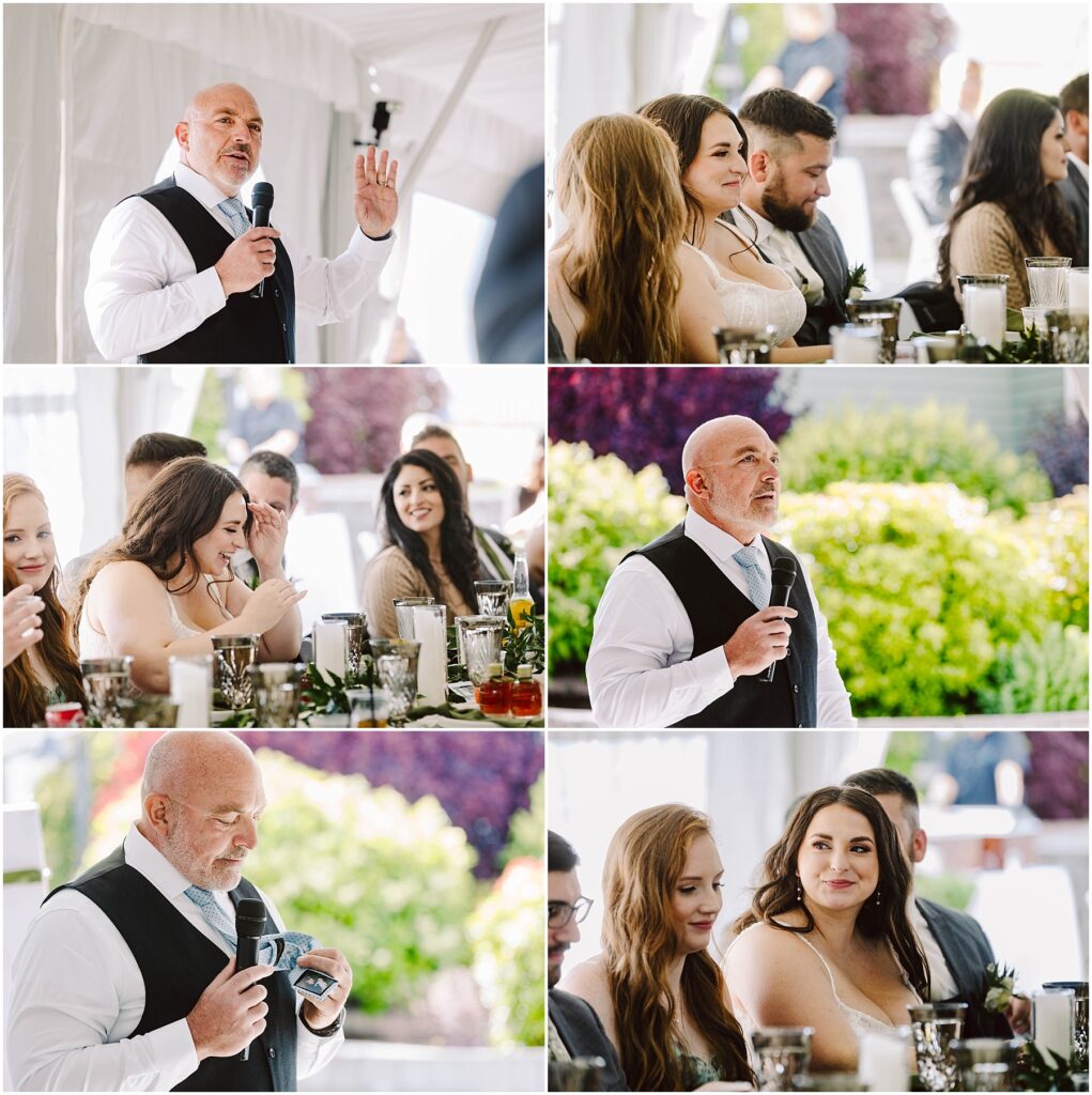 Snohomish Wedding Photographer GSquared Weddings A man in a vest and tie speaks and gestures, holding a microphone at a Port Gamble summer wedding. Guests, some smiling and listening, are seated at tables adorned with flowers and glasses in the bright outdoor setting. Serving Seattle, Snohomish and Orlando