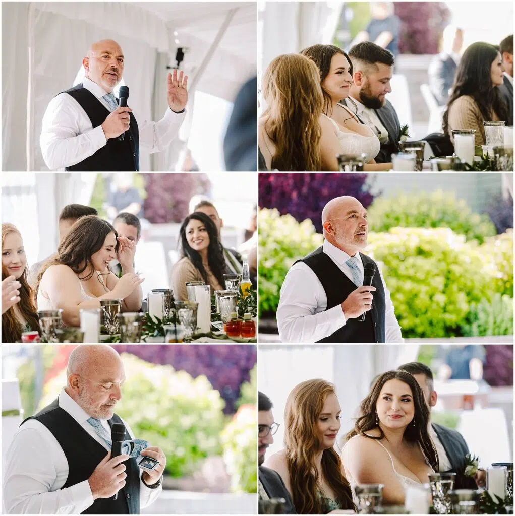 Snohomish Wedding Photographer GSquared Weddings A man in a vest and tie speaks and gestures, holding a microphone at a Port Gamble summer wedding. Guests, some smiling and listening, are seated at tables adorned with flowers and glasses in the bright outdoor setting. Serving Seattle, Snohomish and Orlando