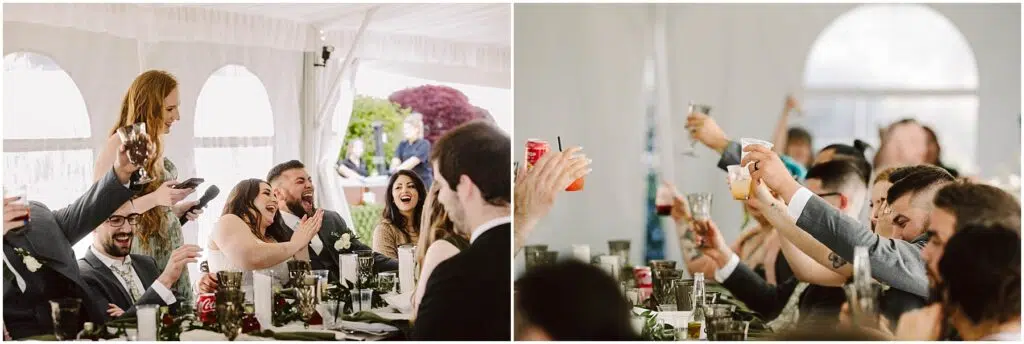 Snohomish Wedding Photographer GSquared Weddings At a charming summer wedding in Port Gamble, people at the reception raise their glasses for a toast. On the left, a woman stands, laughing with guests around a table adorned with drinks and decorations. On the right, guests joyfully lift their glasses, reveling in the lively atmosphere. Serving Seattle, Snohomish and Orlando