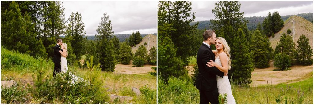 Snohomish Wedding Photographer GSquared Weddings A bride and groom embrace in a scenic outdoor winery setting with lush greenery and hills in the background. The bride wears a long white gown, and the groom is in a black suit. Pine trees and grassy fields surround them under a cloudy sky. Serving Seattle, Snohomish and Orlando
