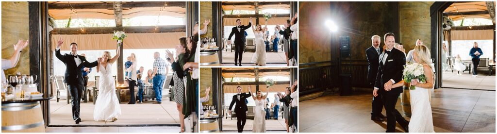 Snohomish Wedding Photographer GSquared Weddings A bride and groom, both smiling, joyfully enter a rustic winery reception hall. The bride is holding a bouquet, and both have their arms raised. Guests are clapping and celebrating in the background surrounded by charming wooden elements. Serving Seattle, Snohomish and Orlando