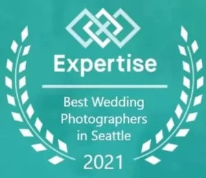 Snohomish Wedding Photographer GSquared Weddings A teal badge with a laurel wreath and interlocking diamond logo, reading Expertise Best Wedding Photographers in Seattle 2021. Serving Seattle, Snohomish and Orlando