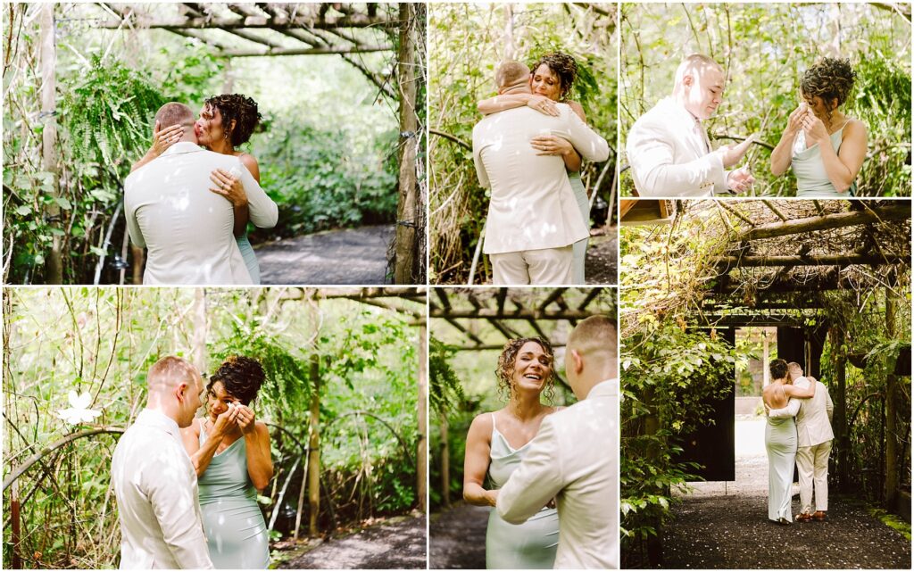 Snohomish Wedding Photographer GSquared Weddings In a lush Snohomish garden, a couple shares an emotional moment. They embrace under a wooden pergola surrounded by greenery. The woman wipes tears and smiles as the man gently comforts her. Both are dressed in light-colored attire. Serving Seattle, Snohomish and Orlando