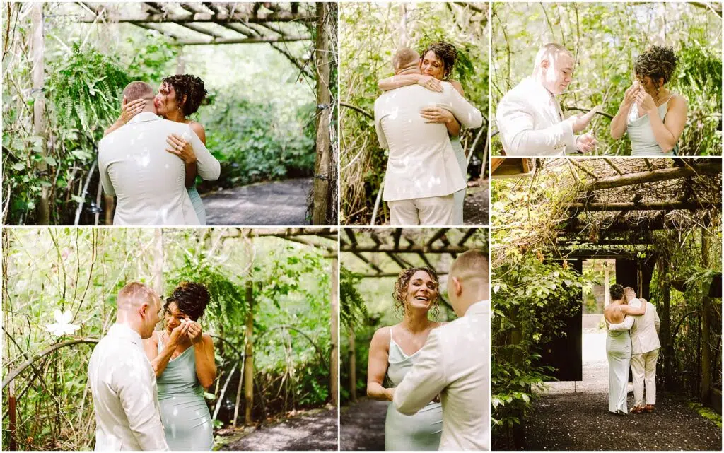 Snohomish Wedding Photographer GSquared Weddings In a lush Snohomish garden, a couple shares an emotional moment. They embrace under a wooden pergola surrounded by greenery. The woman wipes tears and smiles as the man gently comforts her. Both are dressed in light-colored attire. Serving Seattle, Snohomish and Orlando