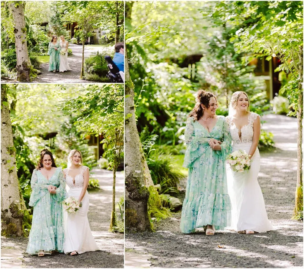 Snohomish Wedding Photographer GSquared Weddings Two women walk arm-in-arm down a tree-lined path in Snohomish. One wears a floral dress with ruffled sleeves, while the other is in a white wedding gown, holding a bouquet. They are smiling and surrounded by lush greenery. Serving Seattle, Snohomish and Orlando