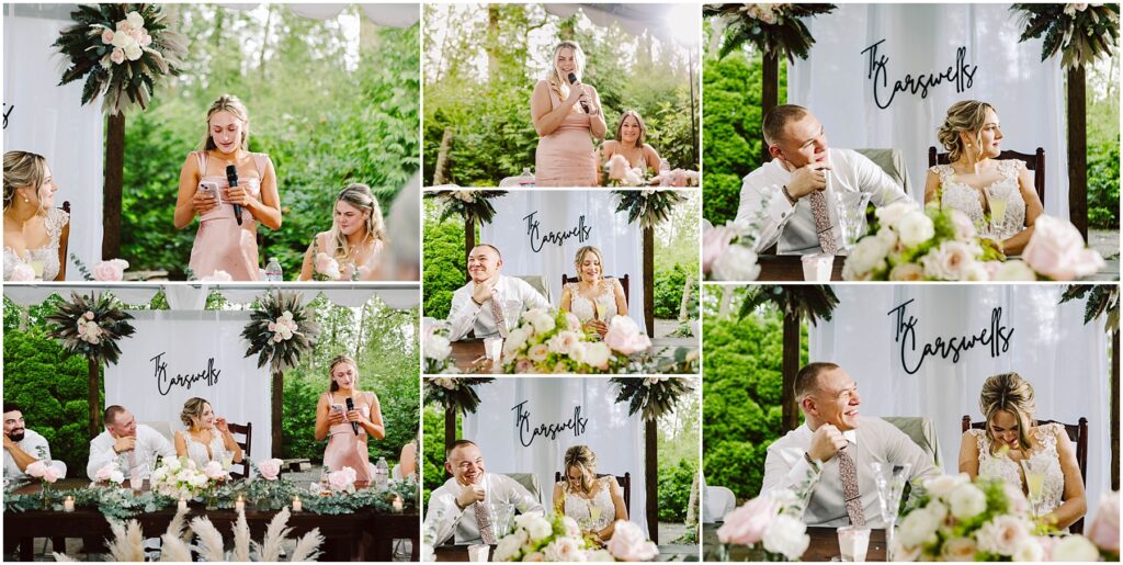 Snohomish Wedding Photographer GSquared Weddings A woman in a pink dress delivers a heartfelt speech, microphone in hand, at a Snohomish wedding. The bride and groom sit at a flower-adorned table, smiling and laughing under the Boswells sign. Lush greenery surrounds the charming outdoor setting. Serving Seattle, Snohomish and Orlando