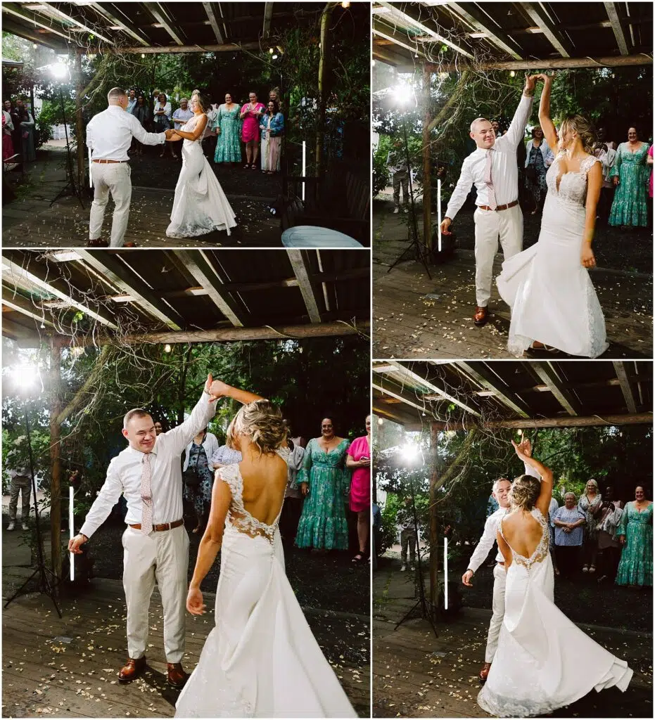 Snohomish Wedding Photographer GSquared Weddings A bride and groom dance joyfully under a rustic, vine-covered wooden pergola in Snohomish. The bride wears a white gown with a low back, and the groom is in a light shirt and pants. Guests watch them enthusiastically in the background. Serving Seattle, Snohomish and Orlando