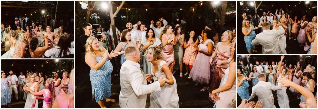 Snohomish Wedding Photographer GSquared Weddings A lively outdoor wedding reception in Snohomish features guests dancing joyfully. The bride, in a white dress, and the groom, in a light suit, take center stage. Friends and family surround them, clapping and smiling under string lights on a wooden patio. Serving Seattle, Snohomish and Orlando