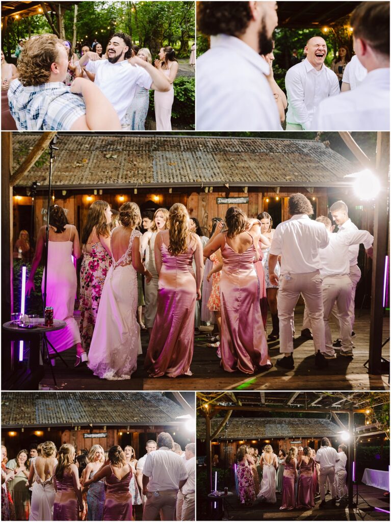 Snohomish Wedding Photographer GSquared Weddings A lively outdoor wedding reception in Snohomish sees guests dancing joyfully. People in formal attire, including pastel and floral dresses, enjoy the evening under string lights, surrounded by trees and rustic wooden structures. Serving Seattle, Snohomish and Orlando