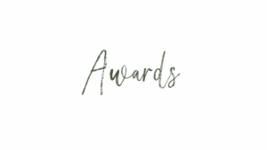 GSquared Weddings Photography The image features the word Awards written in a cursive, handwritten-style font on a plain black background, evoking the elegance of wedding signage. GSquared Weddings | 47.9129° N, 122.0982° W | Serving Snohomish, Seattle , Orlando & Beyond