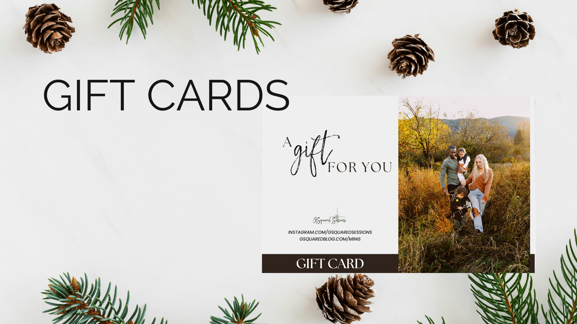Premier Snohomish & Seattle Wedding Photographer | GSquared Weddings Photography A gift card display features the words GIFT CARDS and A gift for you with a family photo in a fall field. The card sits on a white surface decorated with pinecones and evergreen branches. 47.9129° N, 122.0982° W | Candid wedding photo by GSquared Weddings
